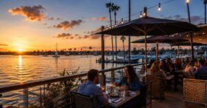 Couples dining outdoors at mission bay waterfront restaurants during sunset in San Diego